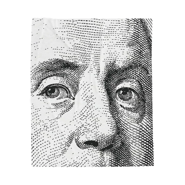 Blanket printed with a close-up of Benjamin Franklin's engraved face from the 100 dollar bill