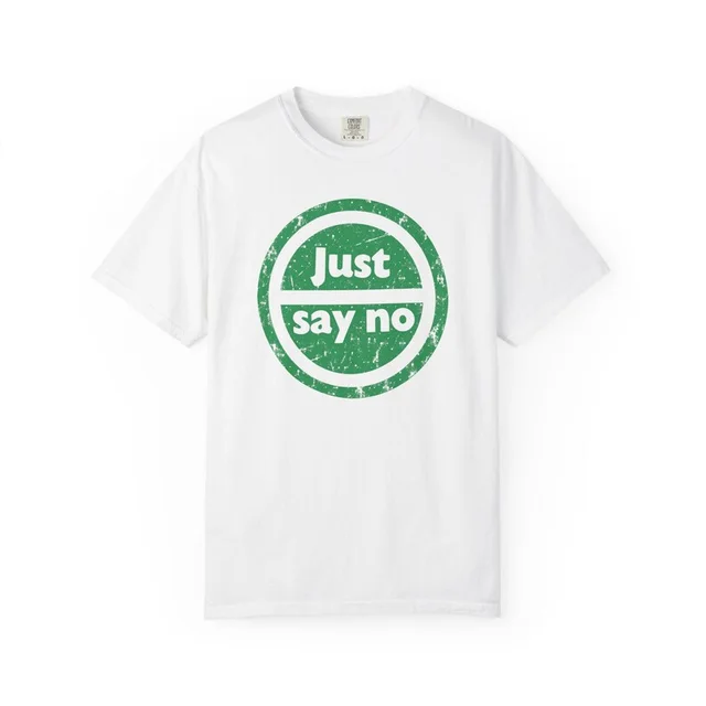 White t-shirt with a distressed green circle logo reading Just say no